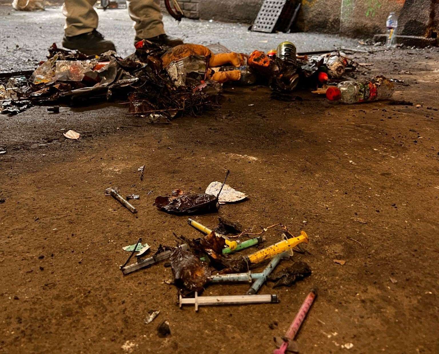 A children’s doll is seen in piles of rubbish. Picture: Peter Phillips