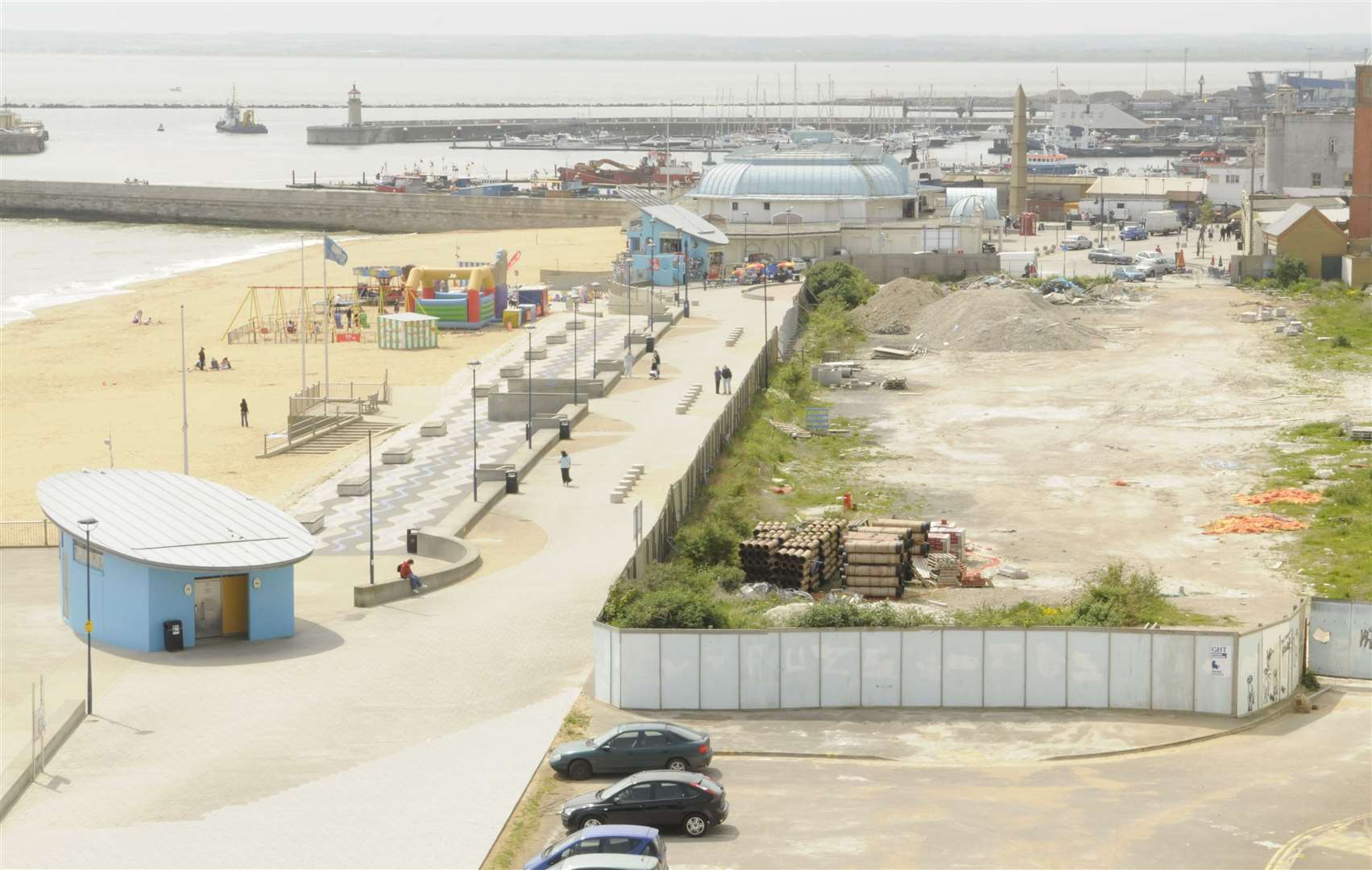 The Pleasurama site in 2009 - at this point it had stood empty for 11 years. The boarded up Royal Victoria Pavilion in the background