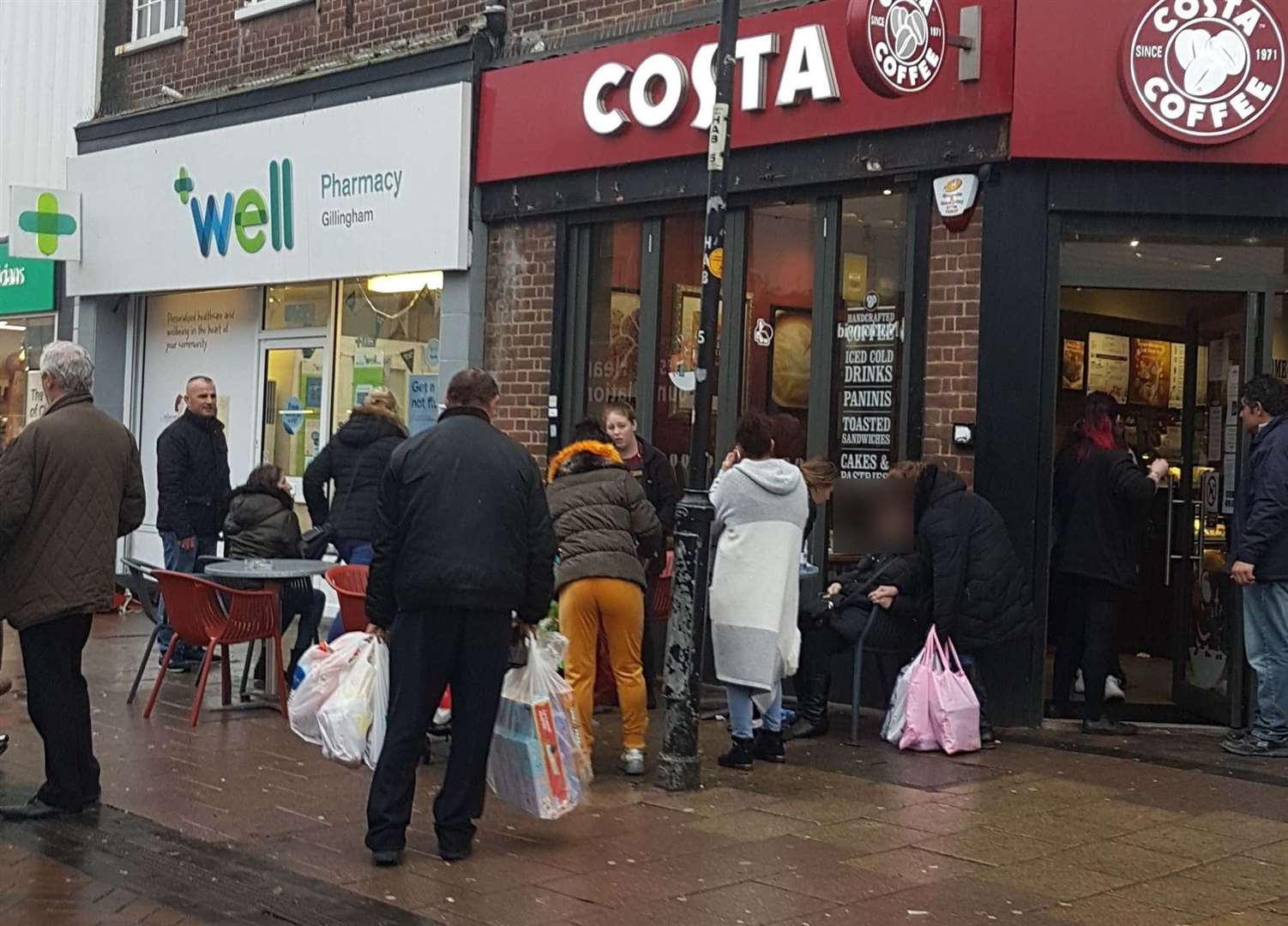 The crowd of people outside Costa Coffee in Gillingham High Street. Picture: Bobby Lockwood