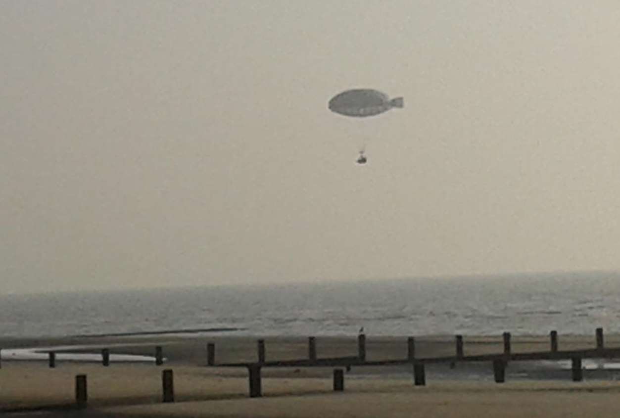 Land ahoy: The record-breaking airship glides over the beach in the early morning light. Picture: Tony Pratt.