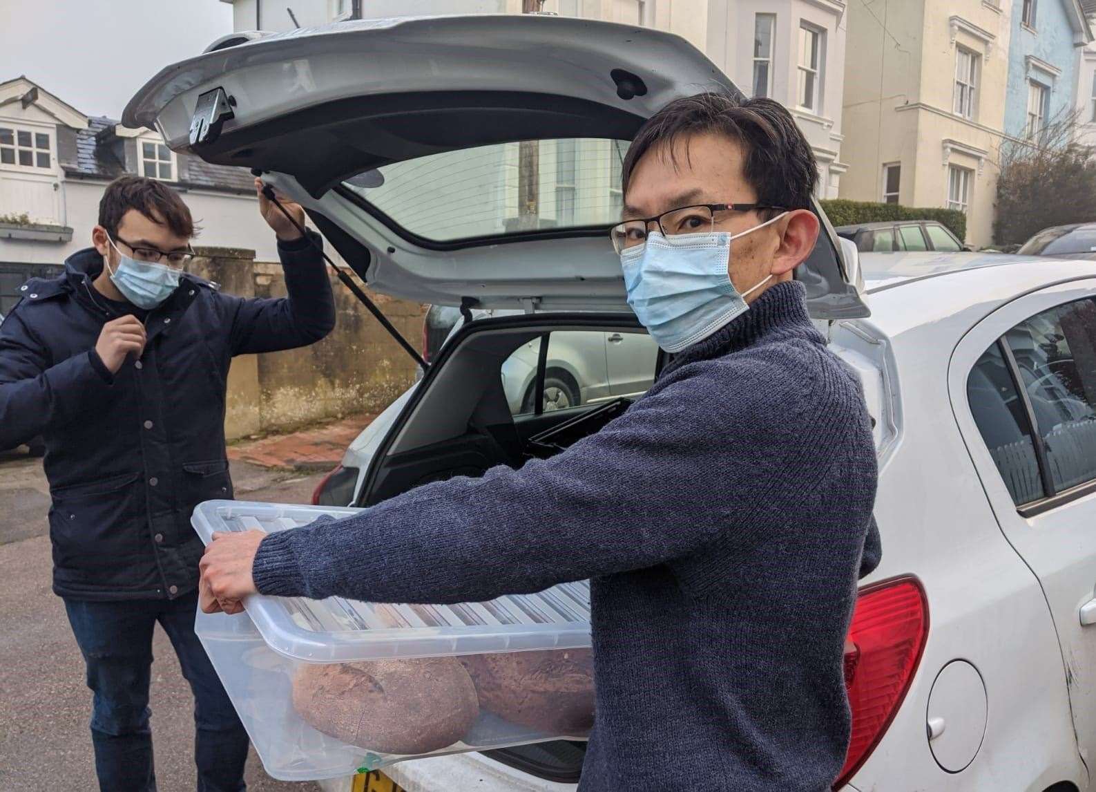 Father and son Terry and Edward Goh out on their deliveries