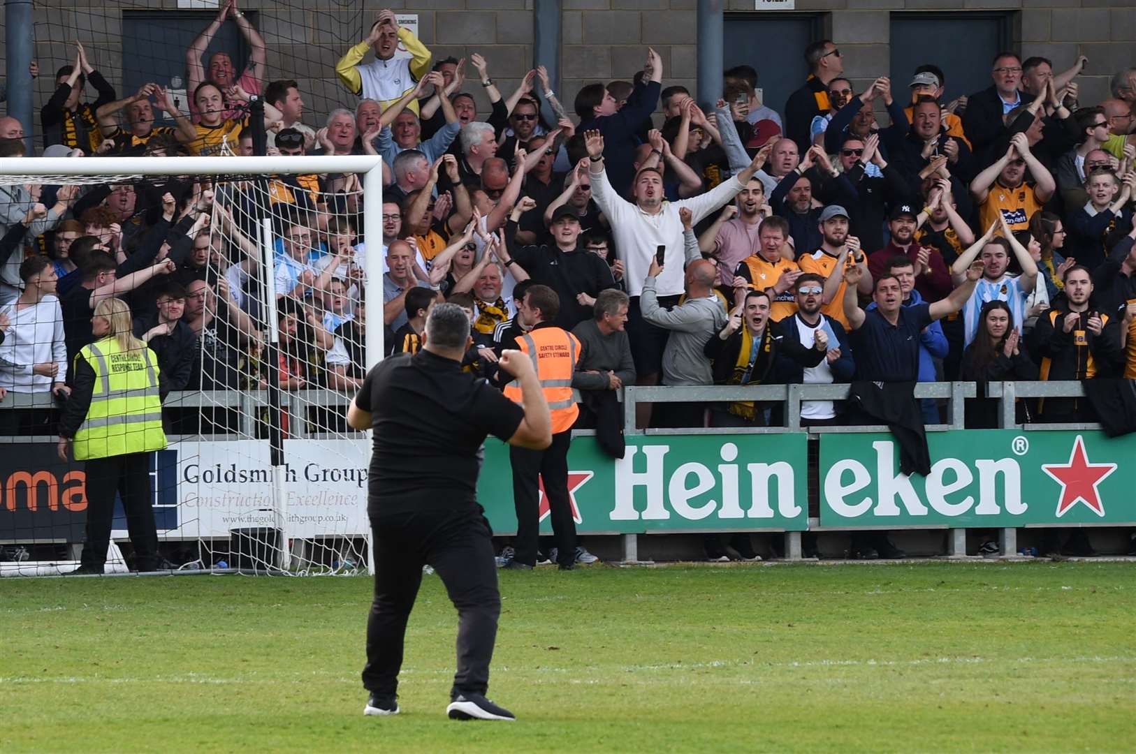 Hakan Hayrettin celebrates with Stones fans following the win at Dartford Picture: Steve Terrell