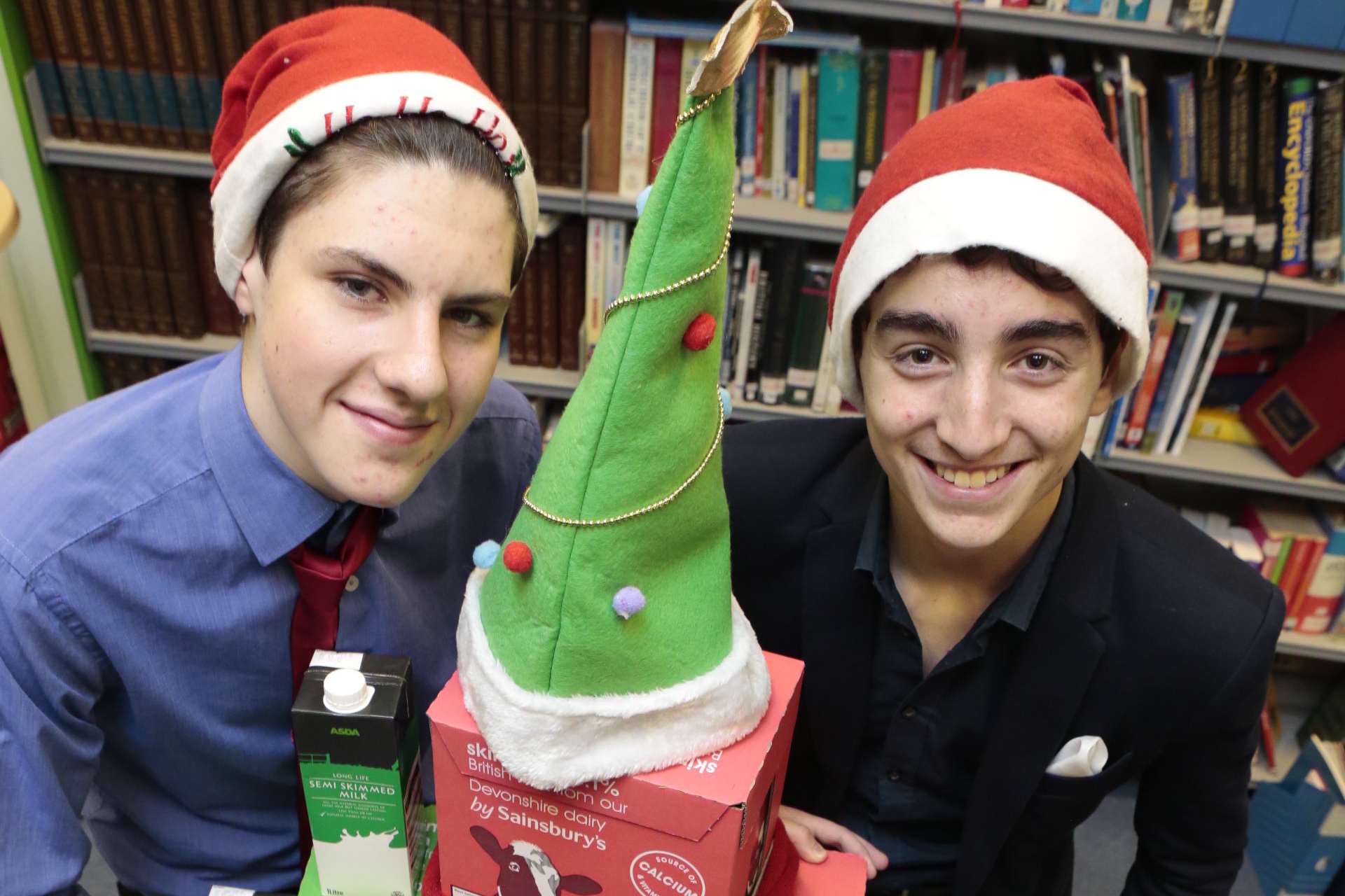 Matthew Dowd and Christian Papa-Adams from St Simon Stock School with a mountain of milk for our You Can help appeal