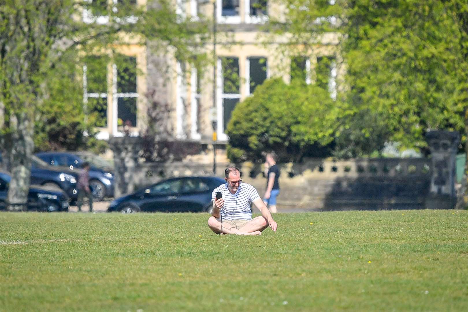 Parks would usually be full in the sunny weather (Ben Birchall/PA)