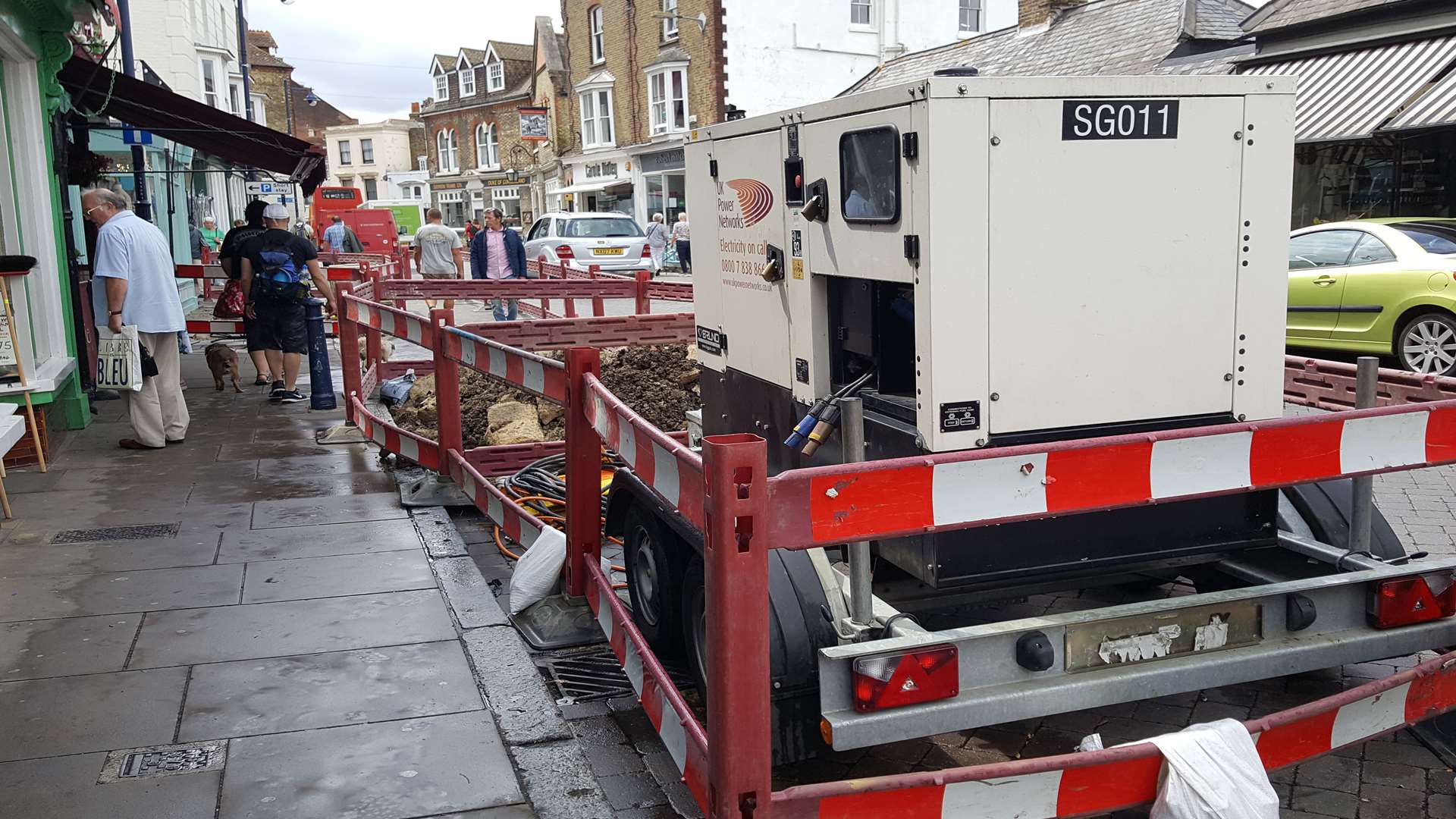 Engineers are repairing an underground electricity cable