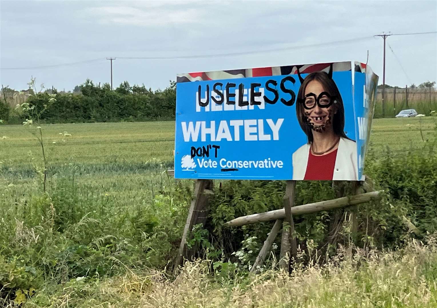 Helen Whately's sign on the A2 near Brenley Corner in Faversham has been vandalised. Picture: Sam Johnson