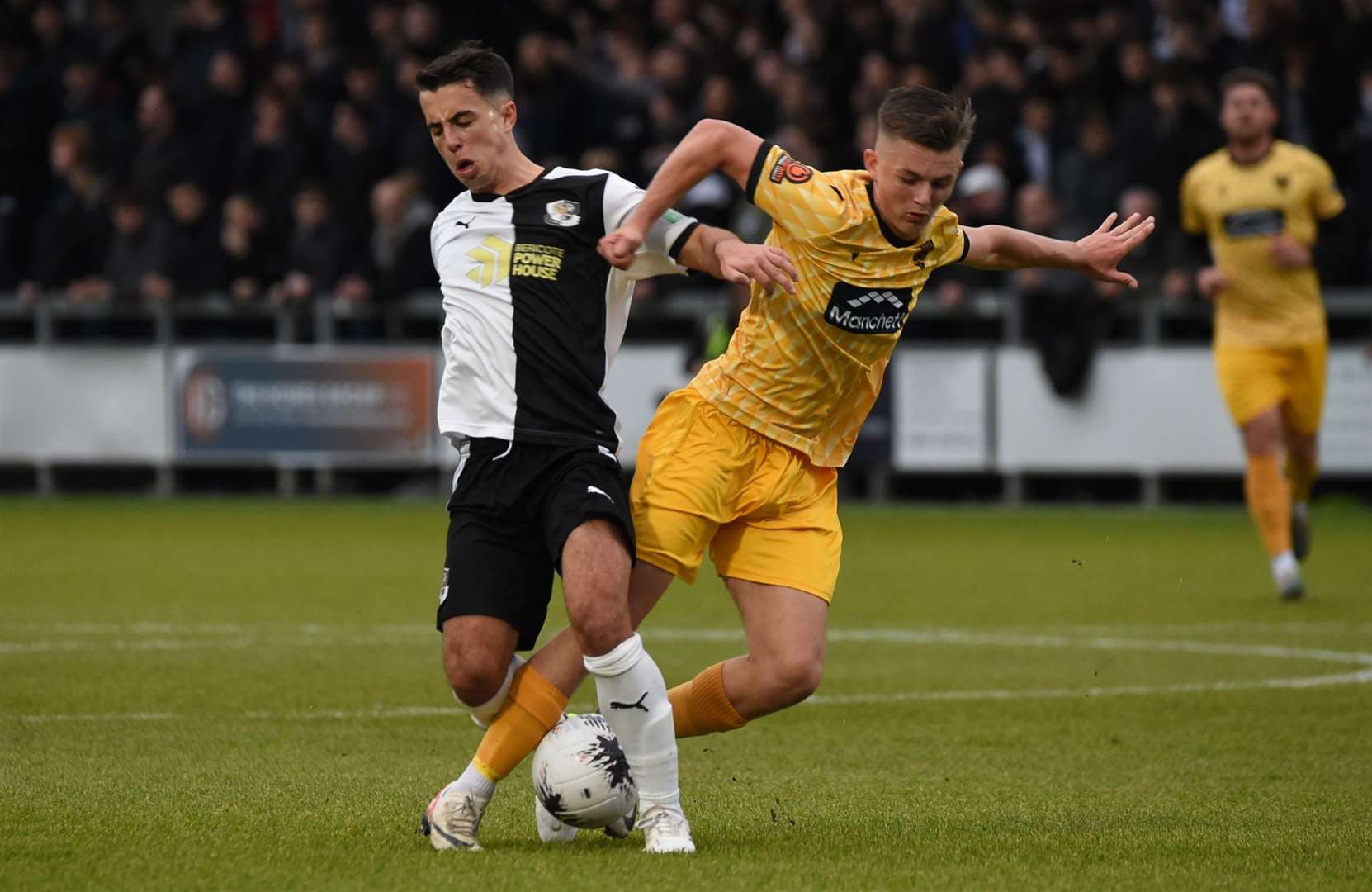 Midfield battle between Archie Woods of Dartford and Maidstone's Riley Court. Picture: Steve Terrell