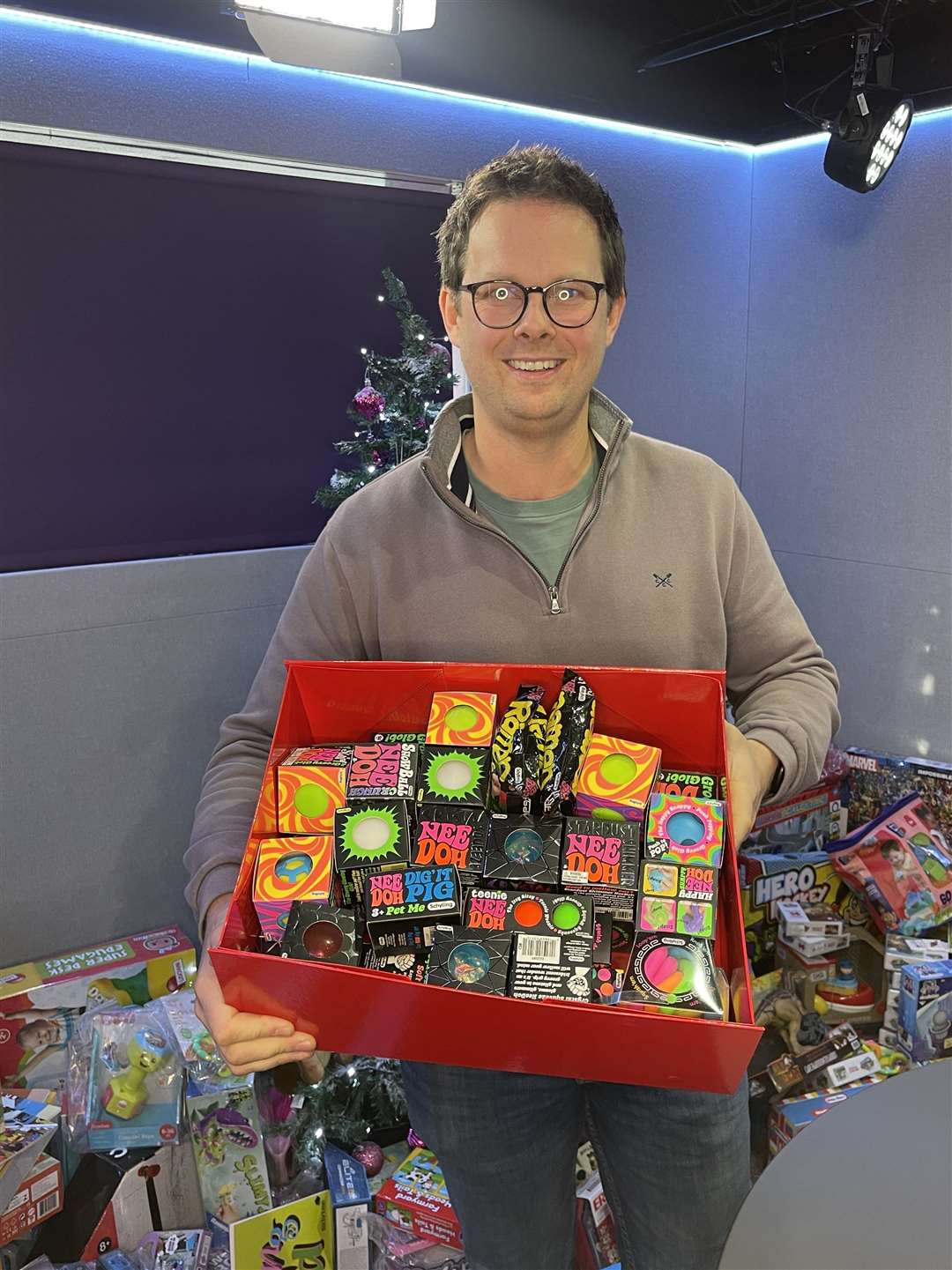 Sam Ireland showing off some of the toys his family firm is donating this year