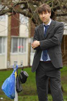 Maidstone councillor Tony Harwood at the site in Boxley Road where a bin has been removed and dog walkers have tied their bags of waste to the post