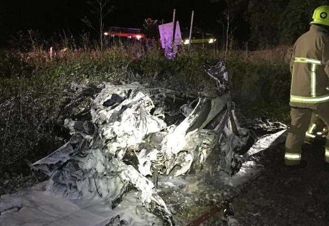 The car burst into flames after it was hit by the train