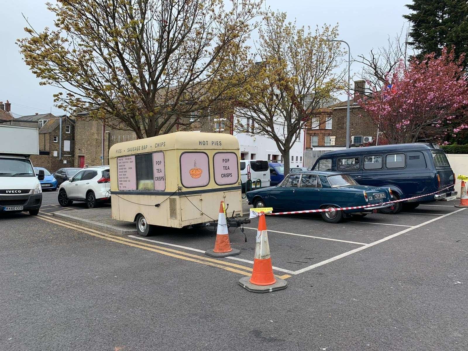 Period vehicles for the filming. The car is a Rover P6 and the van, a Ford Transit