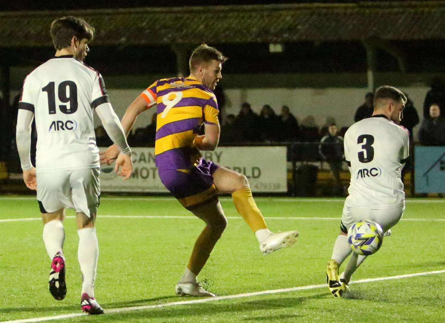 Aaron Millbank seals the win for Deal with a late brace, firing past Faversham substitute Jake McIntyre for this goal. Picture: Paul Willmott