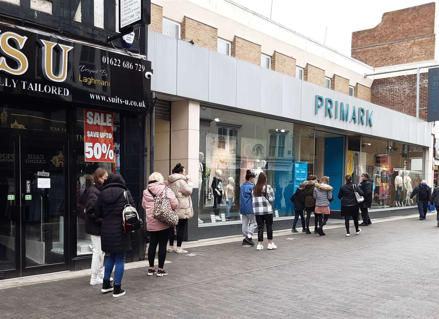 Shoppers queue outside Primark in Week Street, Maidstone