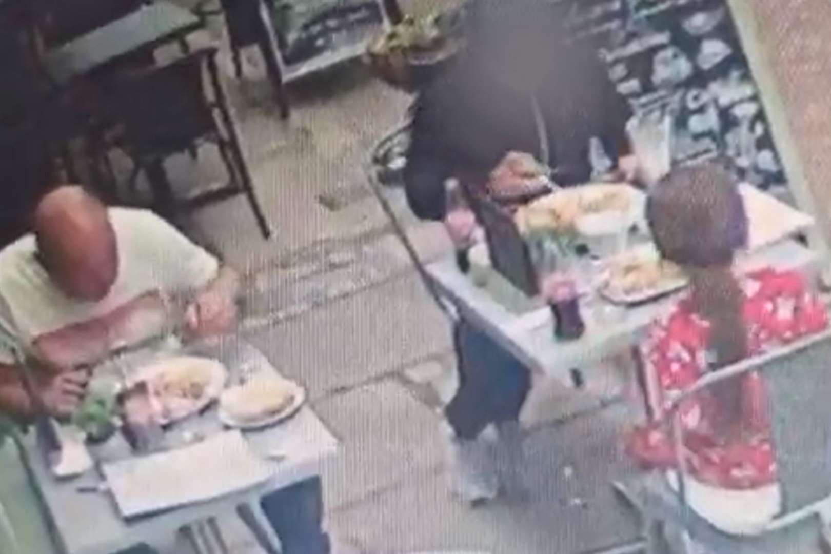 CCTV shows the group of three eating their meals, which came to about £55