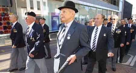 Proud men on the march in the town centre. Picture: RICHARD EATON