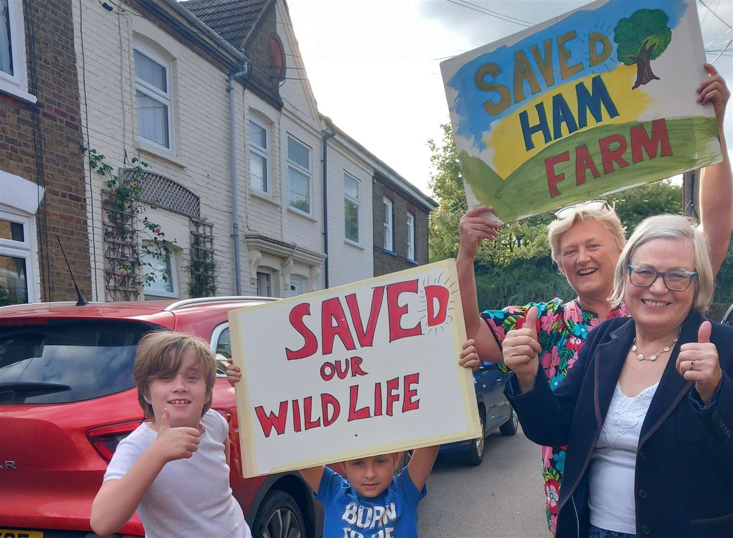 Residents including Ms Beaumont (far right) came together to celebrate after the plan was snubbed