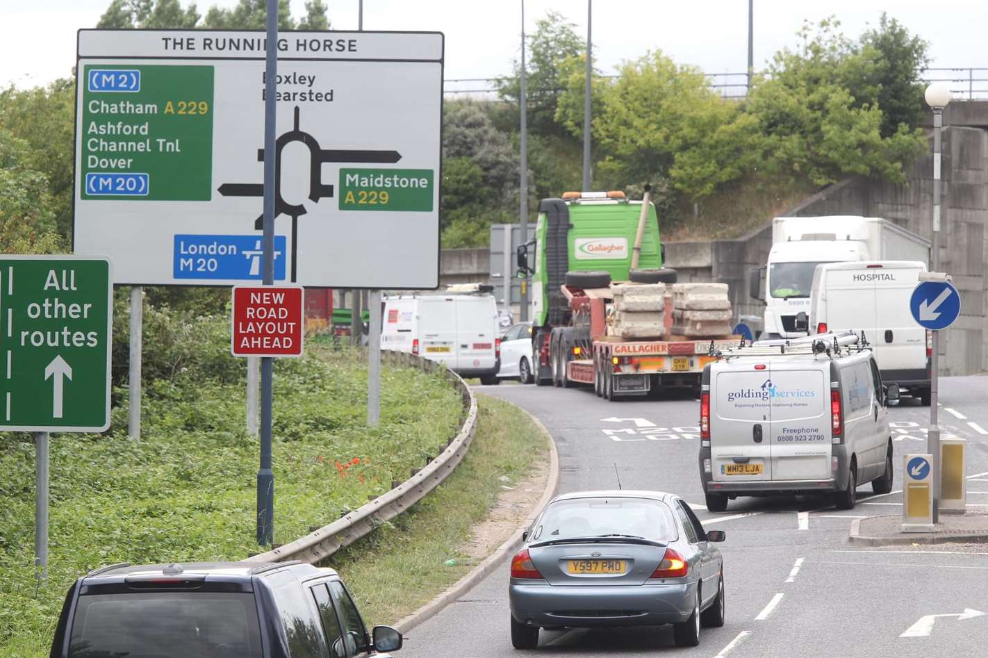 Queuing vehicles heading onto The Running Horse roundabout. Stock Picture