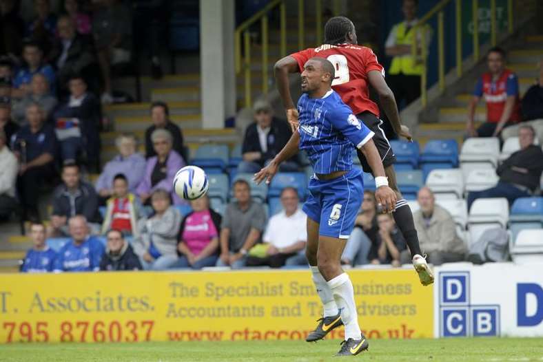 Leon Legge takes on Brentford's Clayton Donaldson Picture: Barry Goodwin