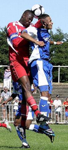 Gillingham's Andrew White, right, and Bromley skipper Jerome Sobers