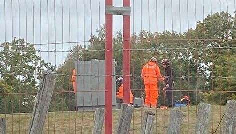 Workers investigate the sinkholes with have opened up in close to Hermitage Lane in Barming near Maidstone