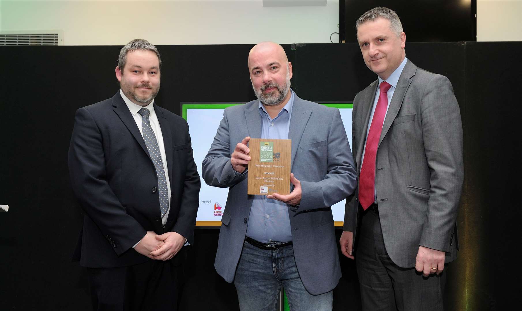 Left to right: Thomas Jenkins (Love Ashford), Scott Tulloch and Andrew Osborne (Love Ashford). Scott, who owns Larry's Mobile Bar, has concocted a selection of signature cocktails such as the ginberry twist or rum punch, and has even sold his drinks at Charlton Athletic FC’s home ground bar after being a lifelong fan of the club. Picture: Simon Hildrew