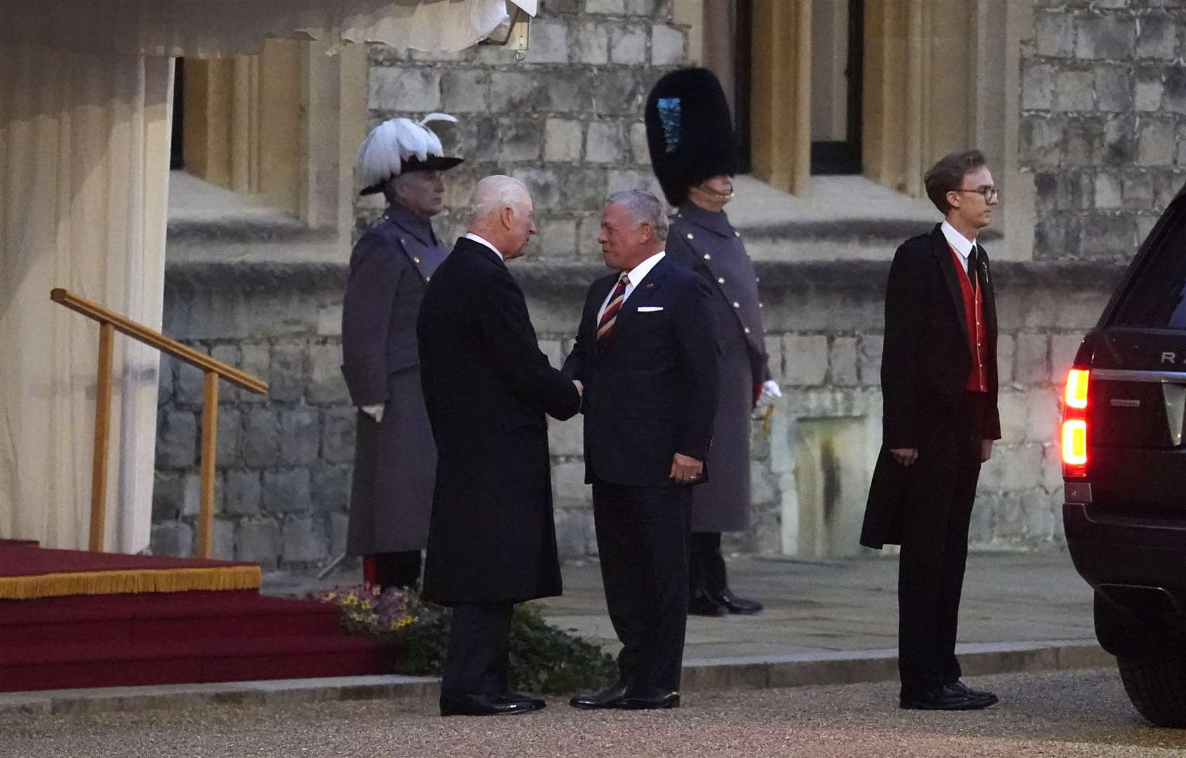 King Abdullah of Jordan is greeted by the King at Windsor Castle (Andrew Matthews/PA)