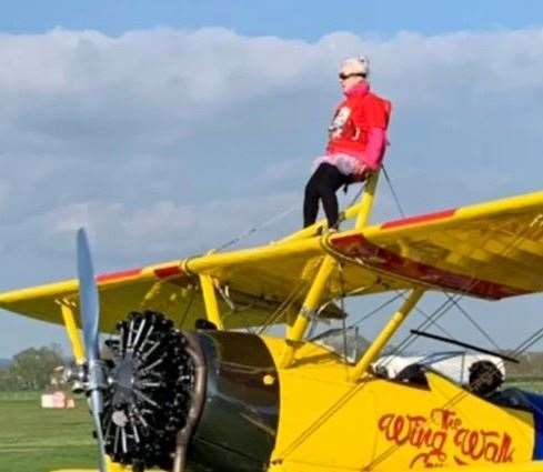 Anne strapped to the plane before take-off