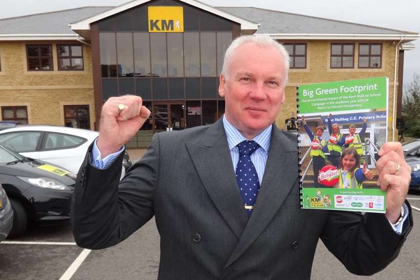 Mark Isom of D Isom Printers Ltd celebrates the launch of the Big Green Footprint report and the opening of the Walk to School Awards for nominations.