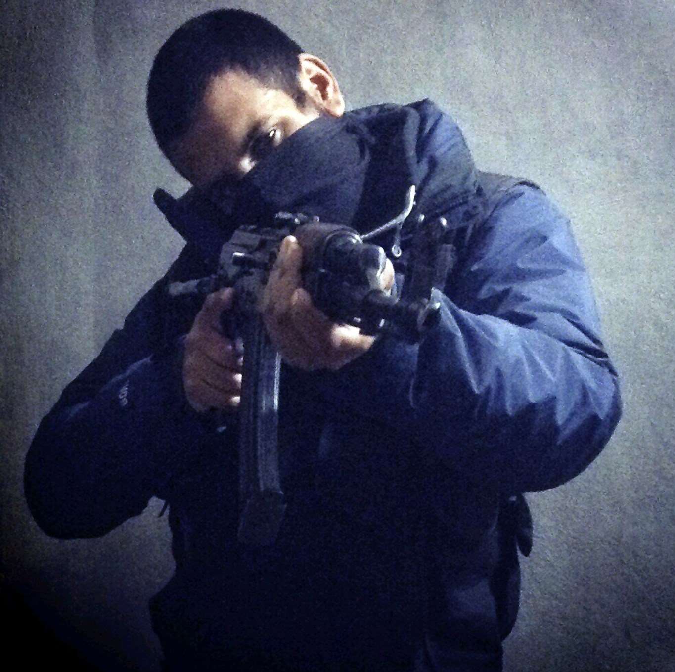 Computer hacker-turned jihadi Junaid Hussain pictured on Twitter with a rifle in his hands.