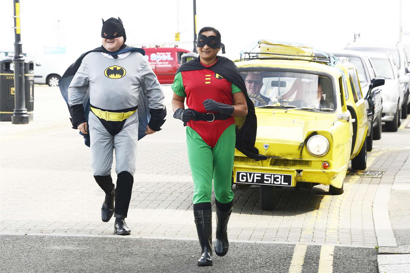 The funeral procession of Peter Wolstenholme goes past Herne Bay Central Parade with its Only Fools and Horses theme, with Batman and Robin running in front. Picture: Paul Amos