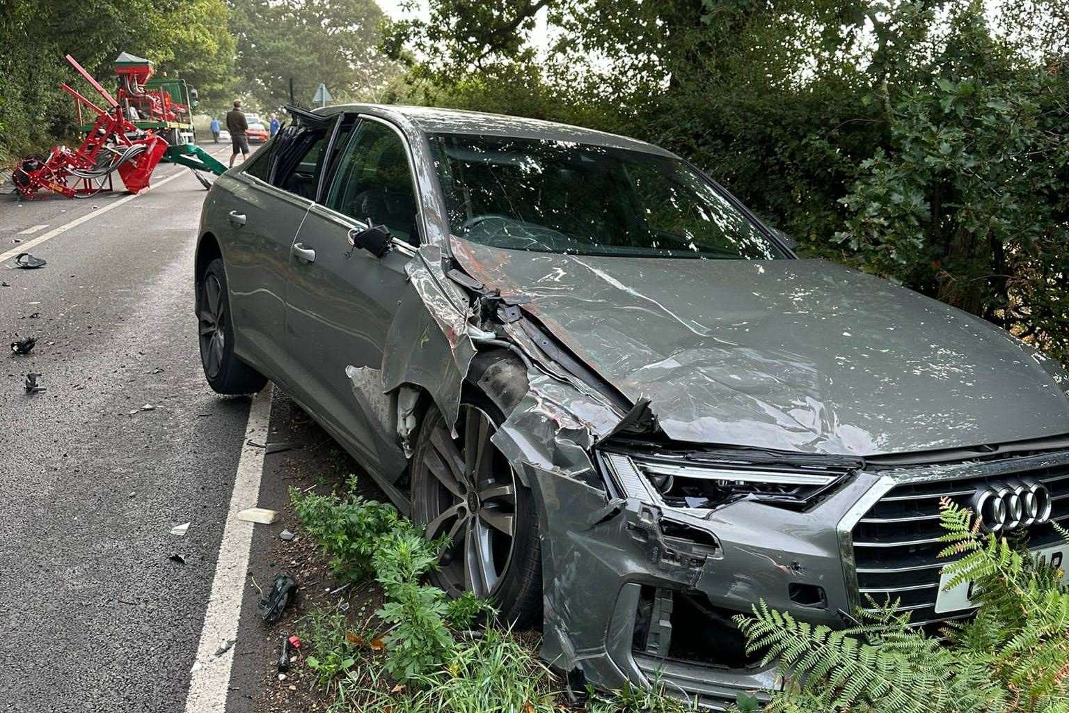 A car suffered damage after farming equipment fell off a lorry on the A257 between Canterbury and Littlebourne. Picture: Atish Patel