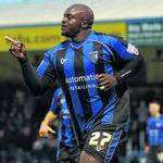 Adebayo Akinfenwa celebrates his winner against Stevenage