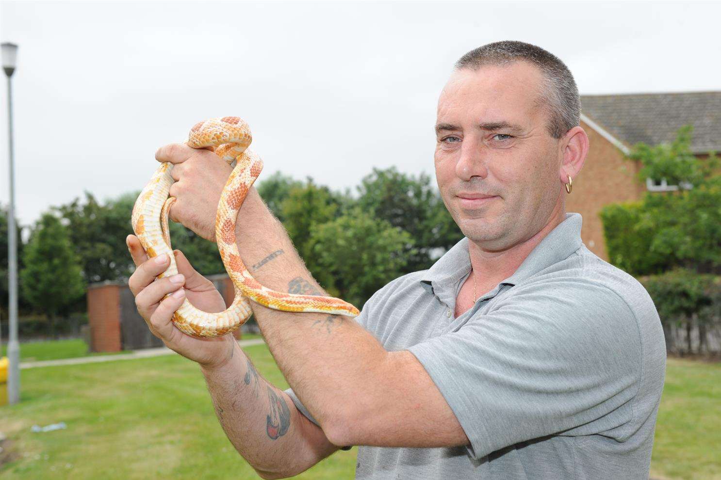 Wayne May with a corn snake.