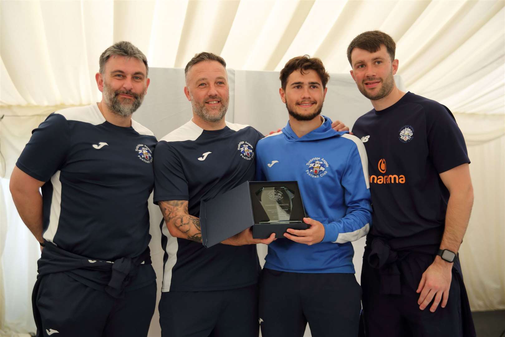 Lloyd Blackman, Jay Saunders and Tom Parkinson pictured with Tonbridge midfielder Lewis Gard. Picture: David Couldridge