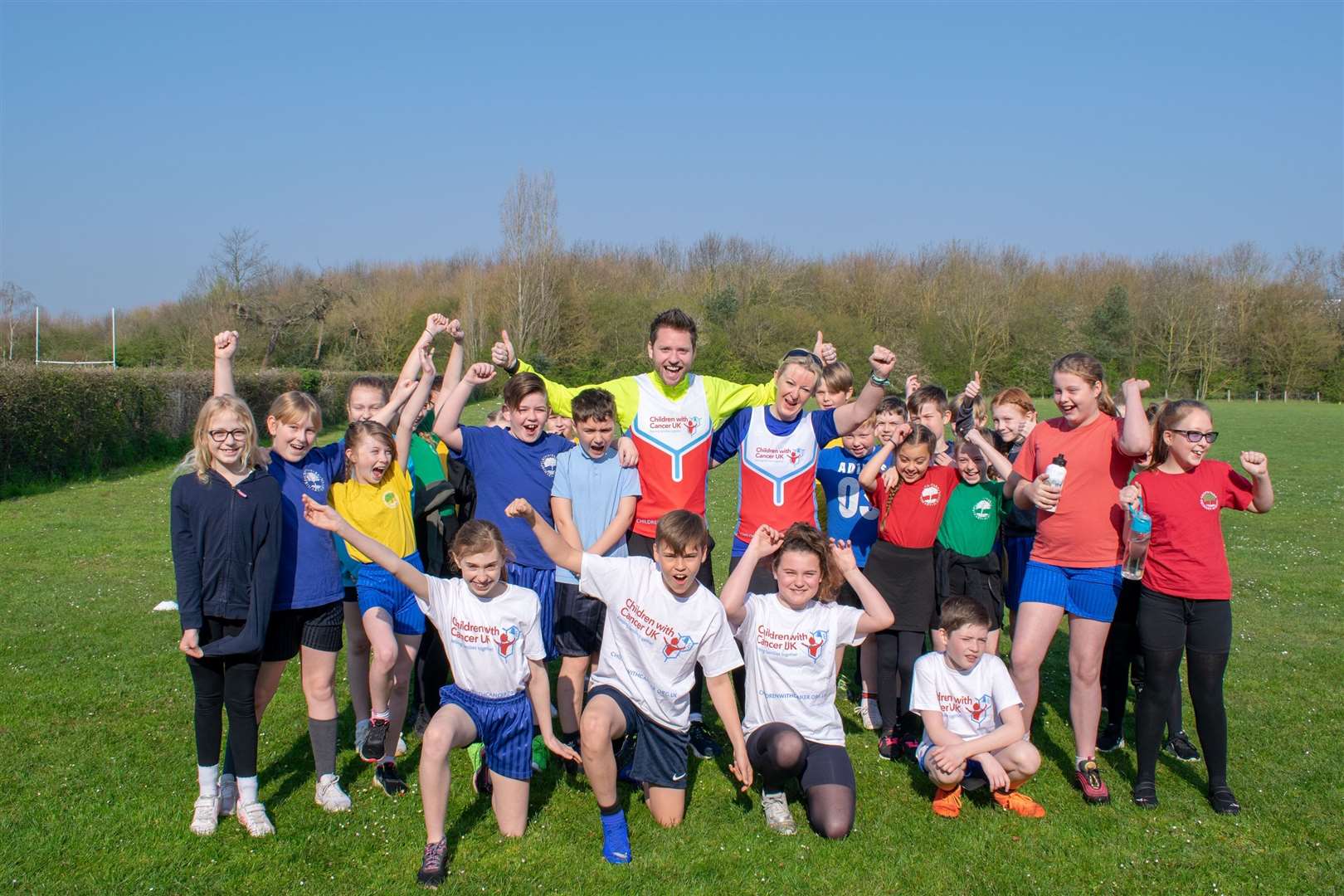 Grove Park teacher Christopher Denney and Nicola Day with pupils