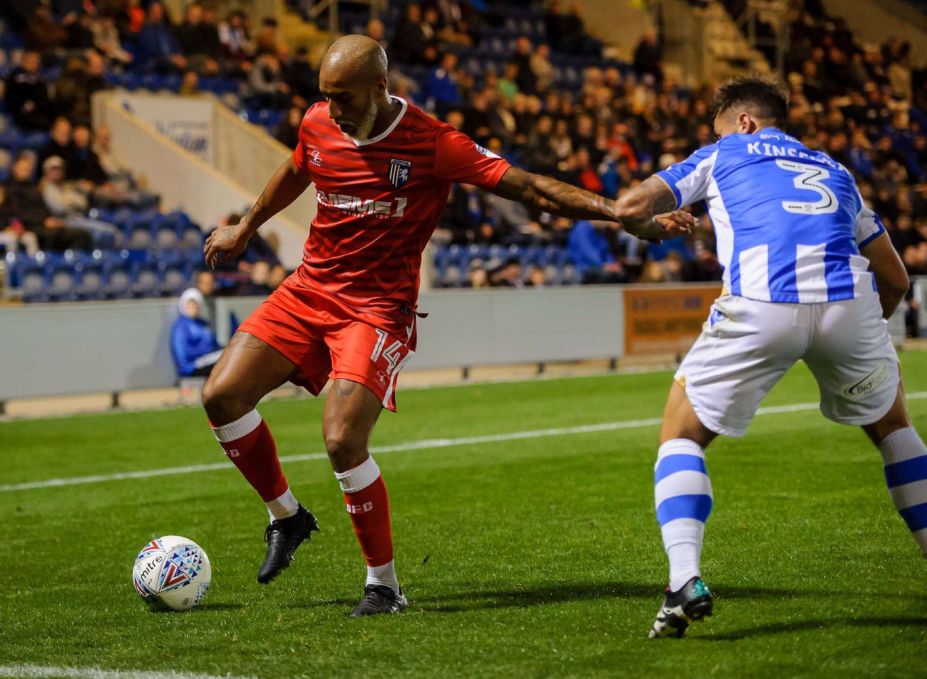 Josh Parker fends off a challenge from Lewis Kinsella Picture: Andy Payton