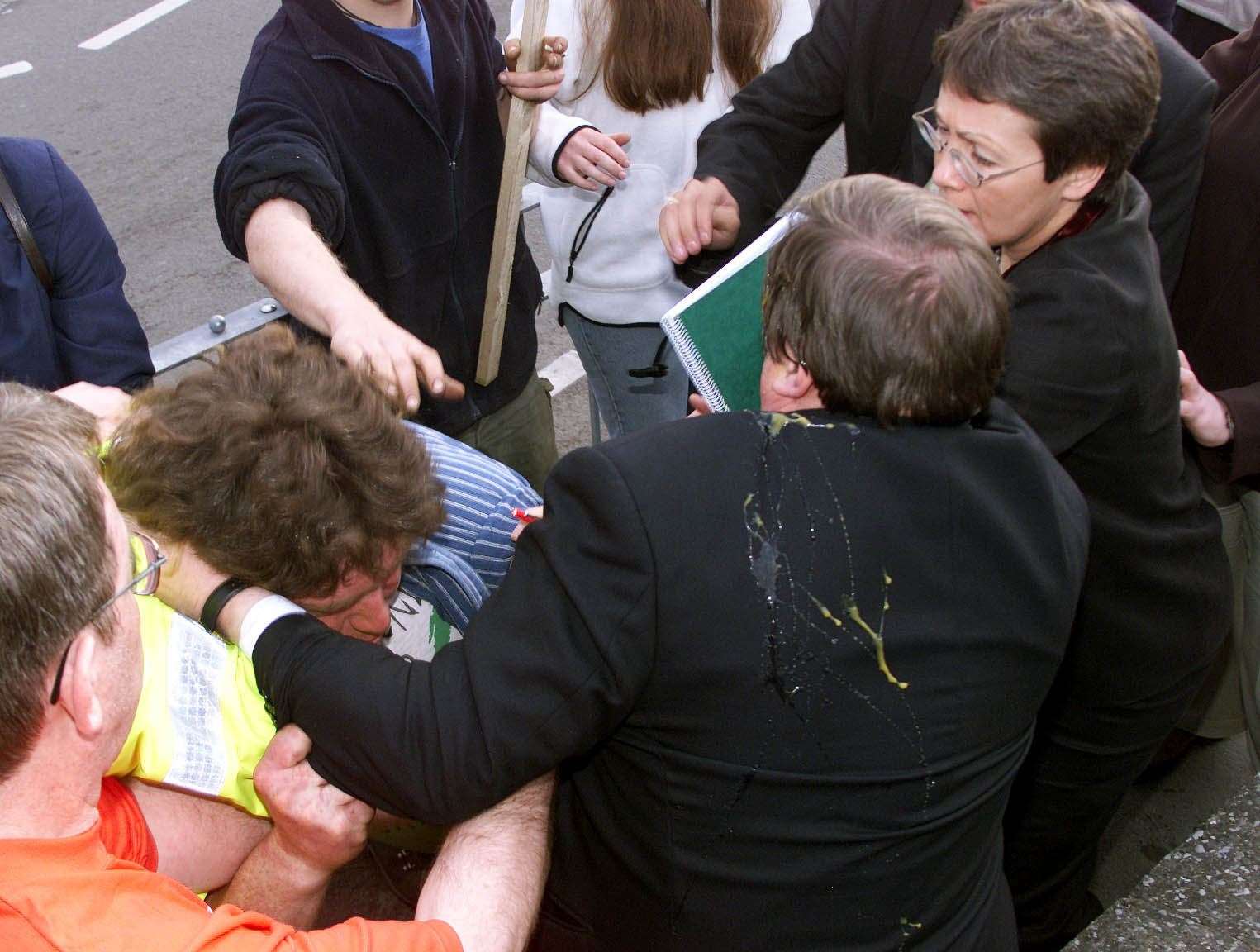 John Prescott being surrounded by protesters after he was hit by an egg (PA)