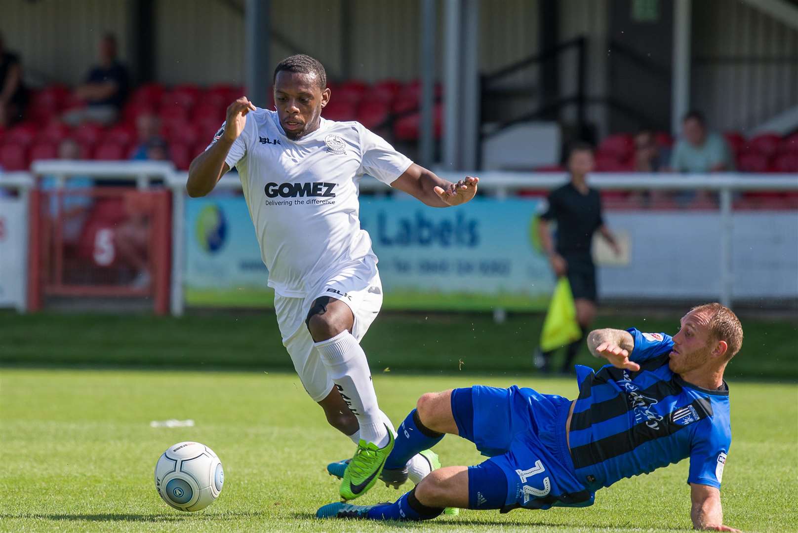 Anthony Jeffrey skips past a challenge from Barry Fuller. Picture: Alan Langley