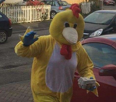 Keeping spirits up... the giant chicken delivering food to villagers. Picture: Jane Morgan