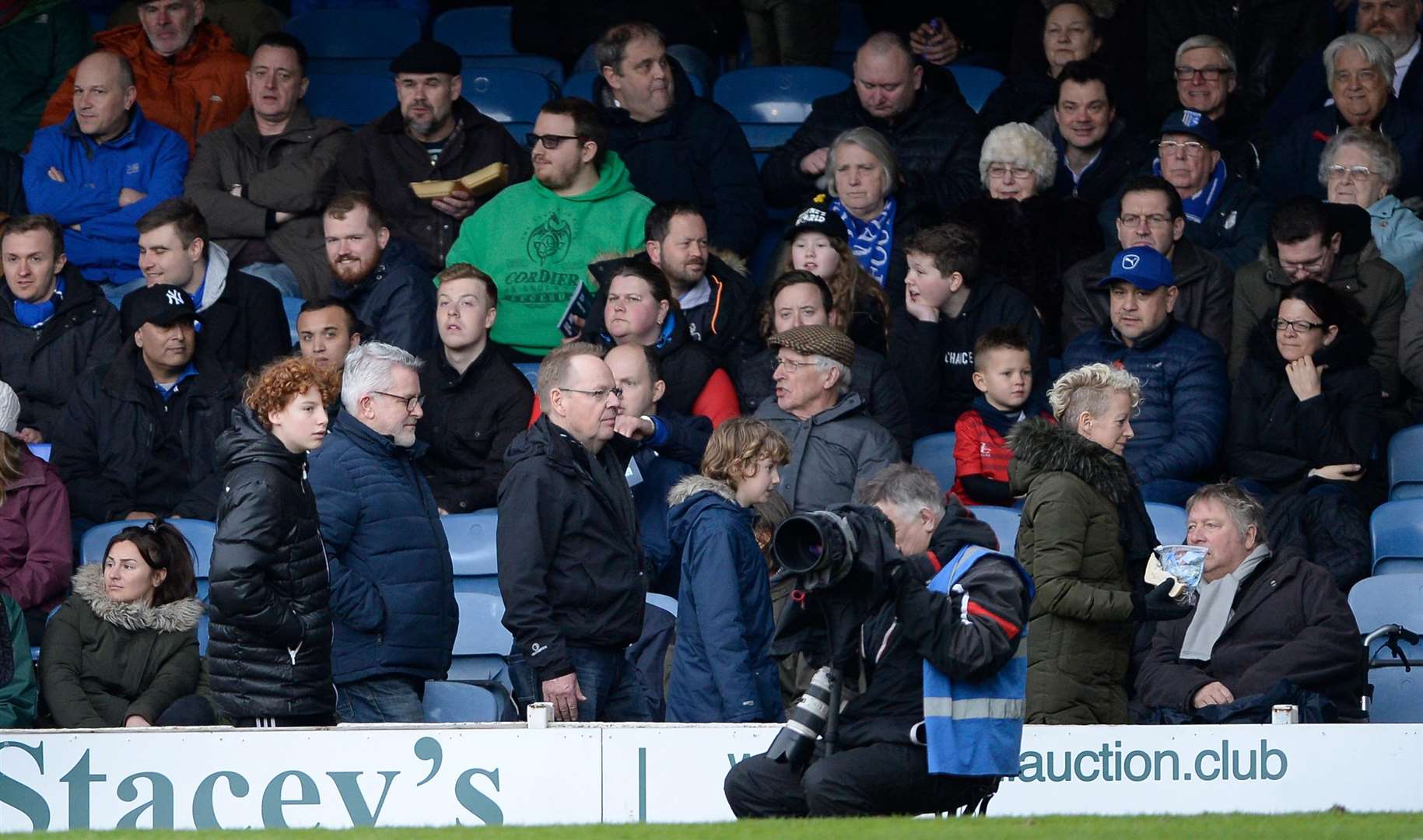 Gills fans head for the exits (or a half-time pint) after Southend score their fourth goal. Picture: Ady Kerry