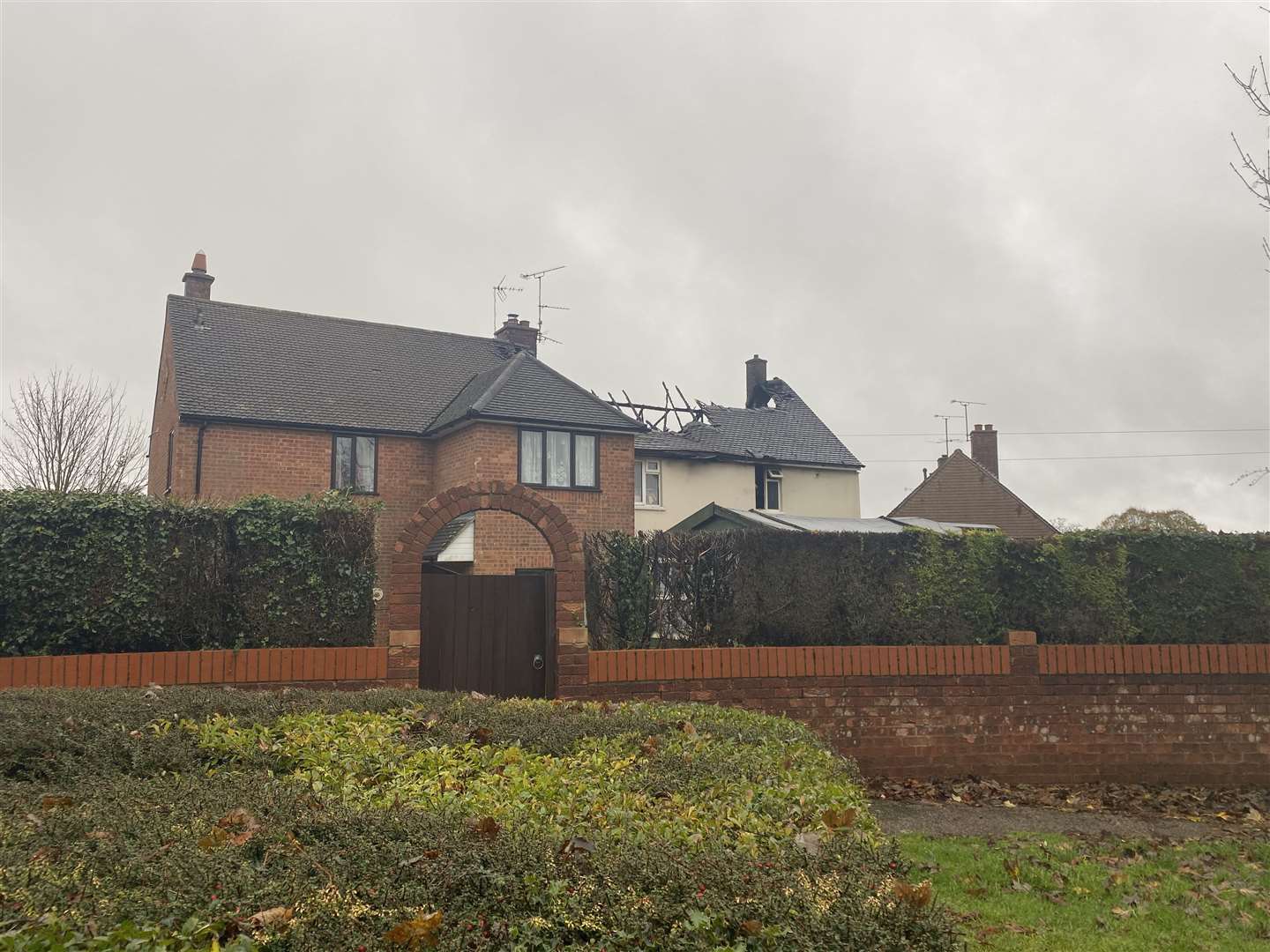 The roof of the house collapsed and a woman had to be treated after breathing in smoke