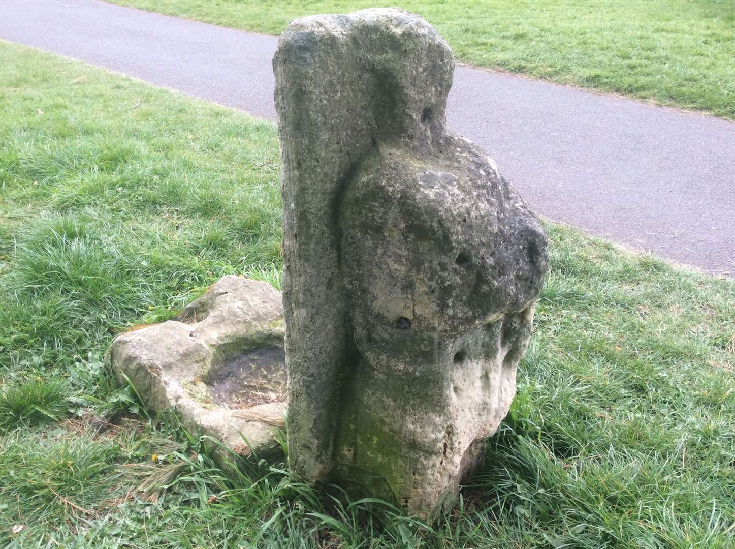 The plague stone stands next to the Hob Stone featuring the weather-eroded likeness of a knight (PA)