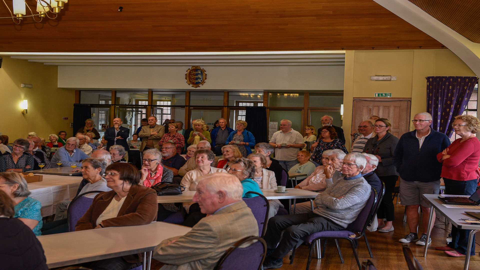 The audience listened to Phil Birch's farewell speech