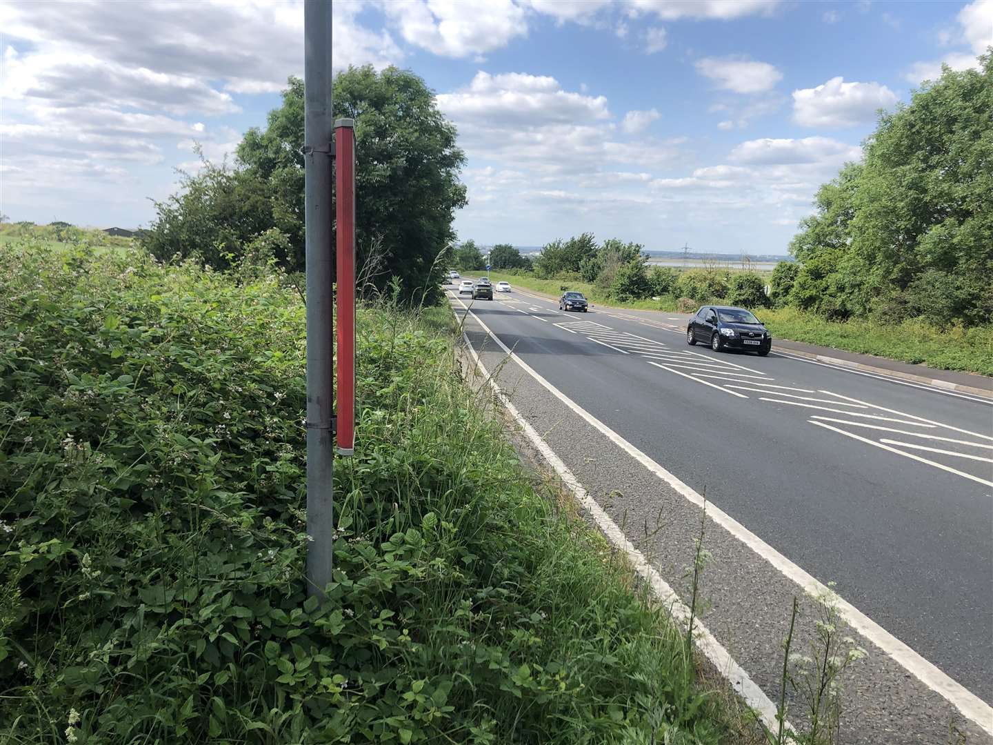 One of the bus stops where passengers get off onto a grass verge with no path