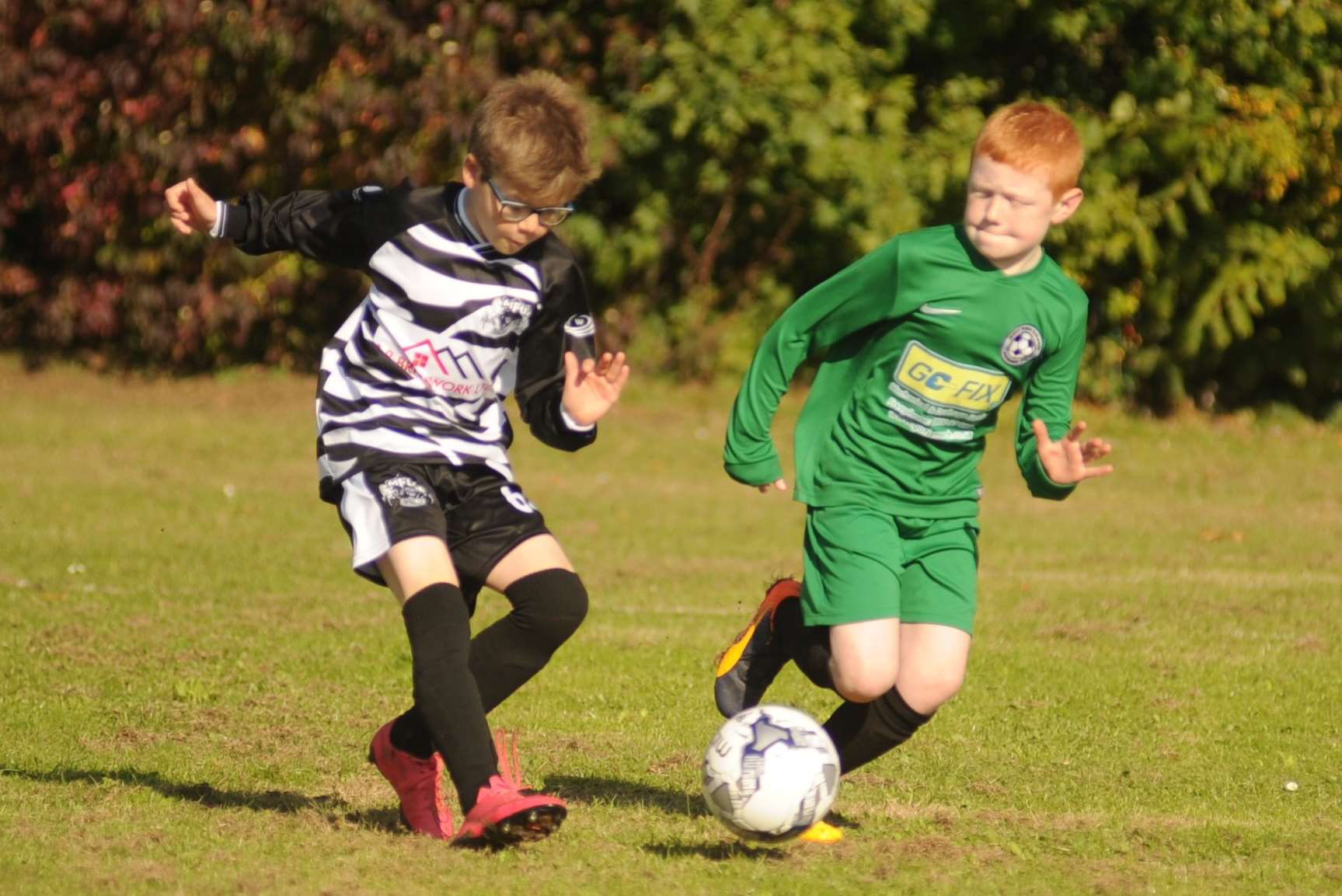 Milton & Fulston United under-10s in possession against New Ash Green Picture: Steve Crispe