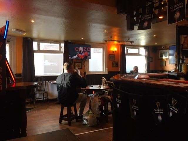 The lower half of the bar has two TV screens, both showing a meaningless darts competition. If you look carefully you’ll spot the disguised step I tripped up in such an ungainly manner