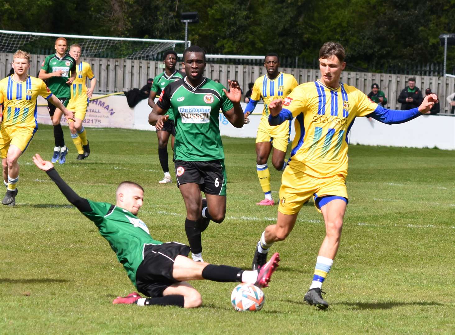 Sittingbourne goalscorer Mitchell May is tackled by Ross Craig of Phoenix. Picture: Alan Coomes