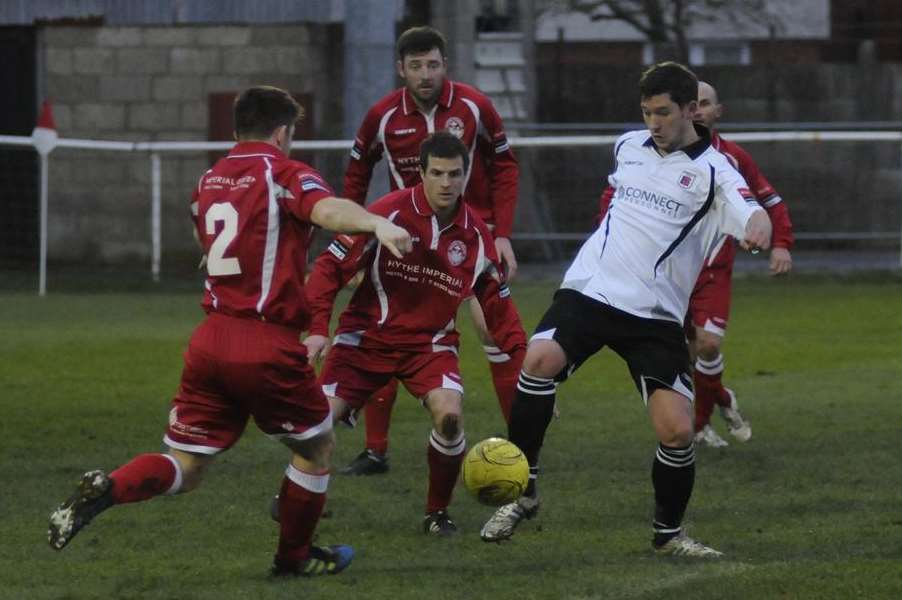 Faversham's Brendon Cass takes on the Hythe defence (Pic: Paul Amos)