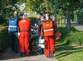 Emergency services convey the casualty to the air ambulance