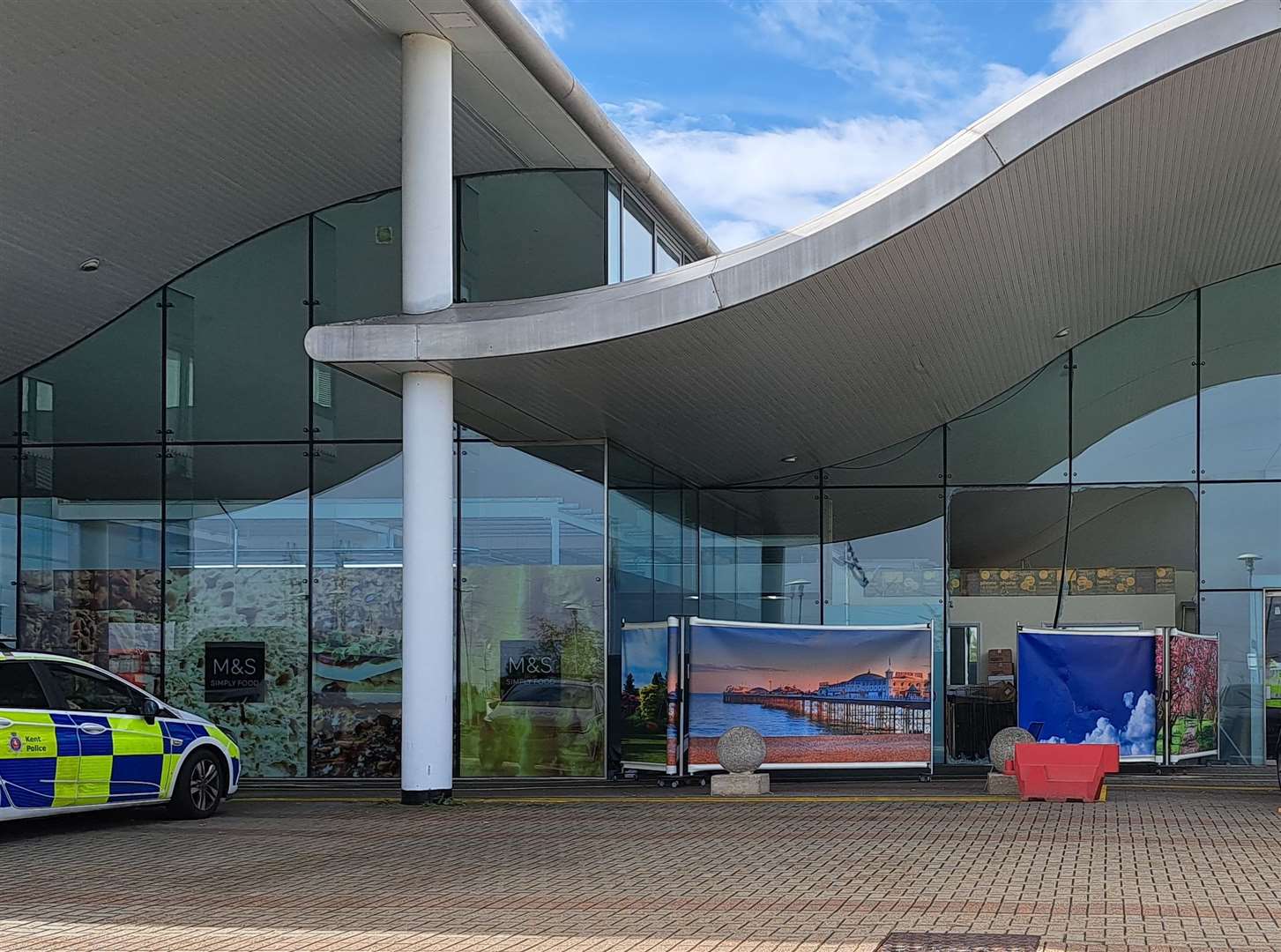 The area around the main entrance at Darent Valley Hospital has been cordoned off after a car smashed through the glass this morning